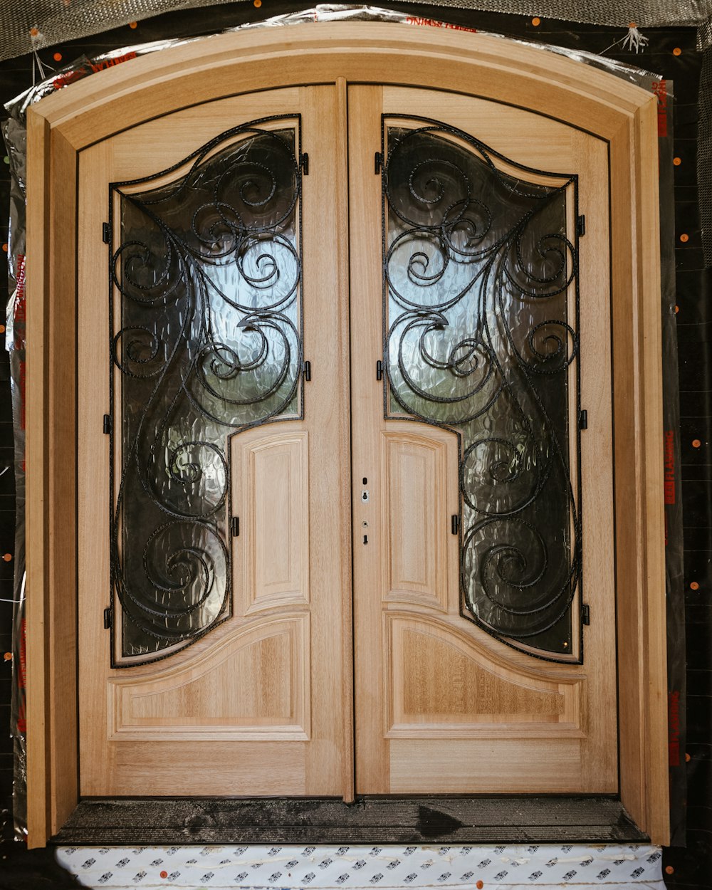 a wood cabinet with a painting on it