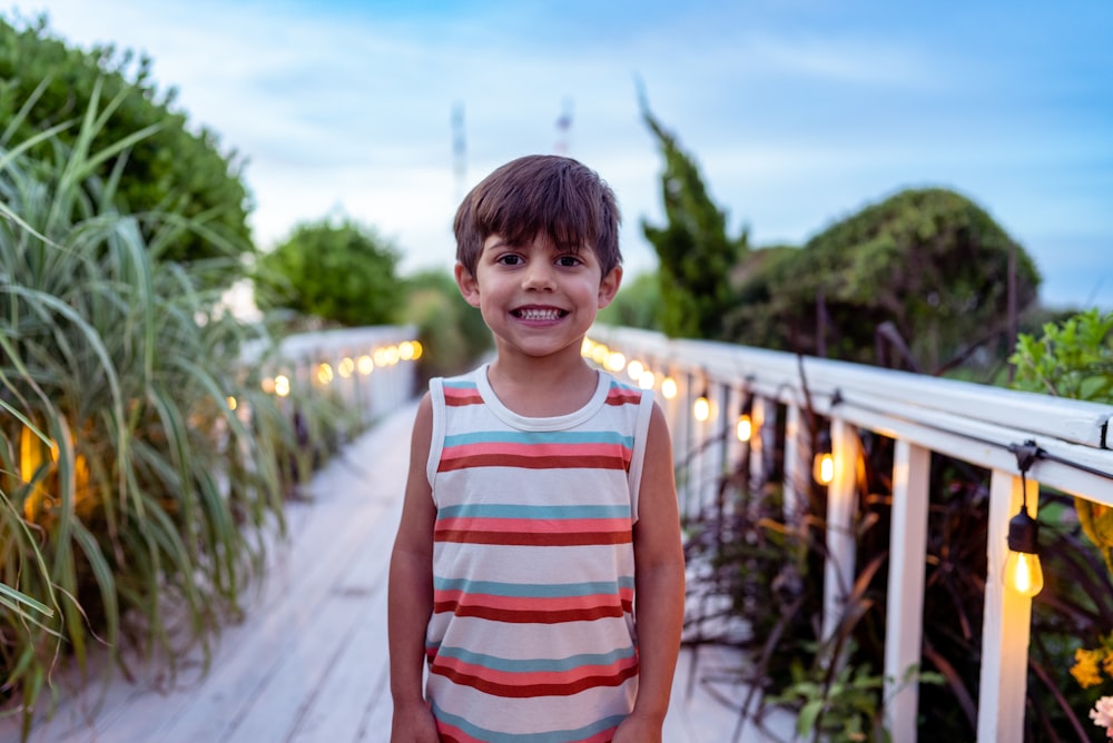 a boy standing on a path