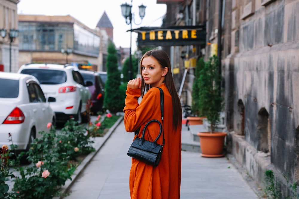 a person in an orange dress