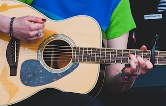 a person playing a guitar