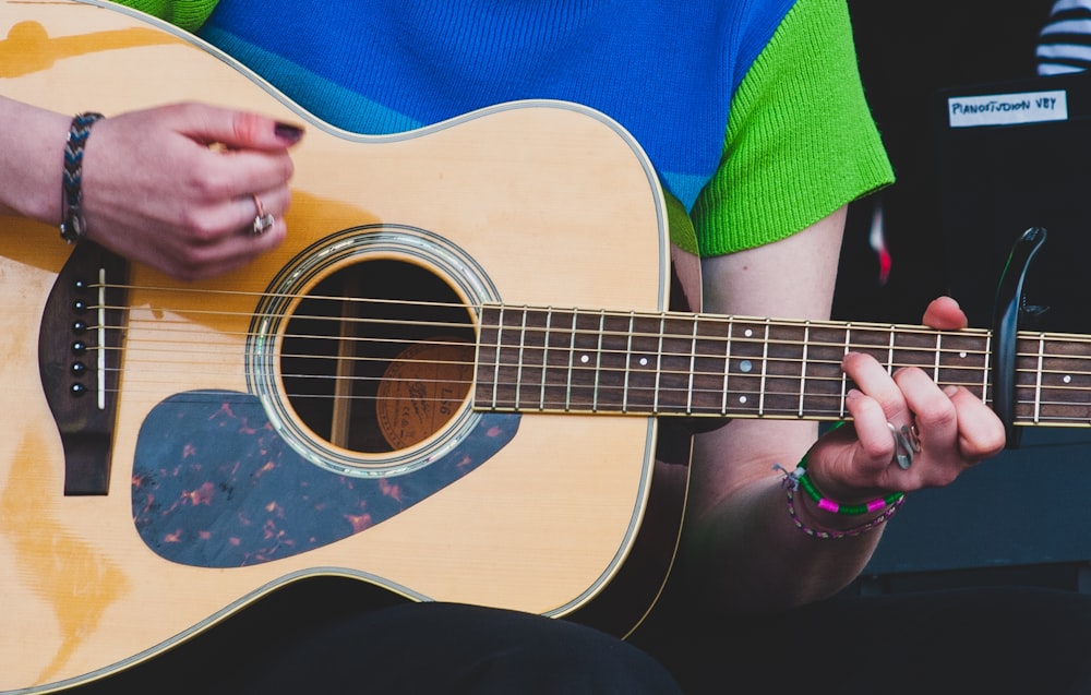 a person playing a guitar