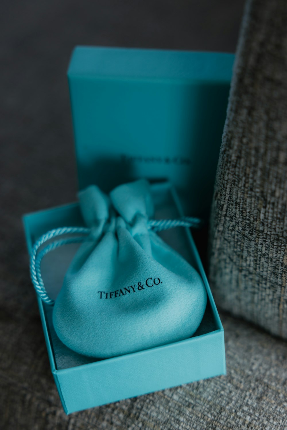 a blue box with a white ribbon