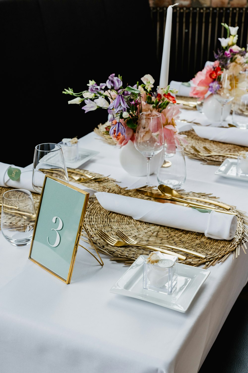 a table with a basket and glasses