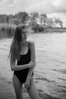 a woman in a swimsuit on a beach