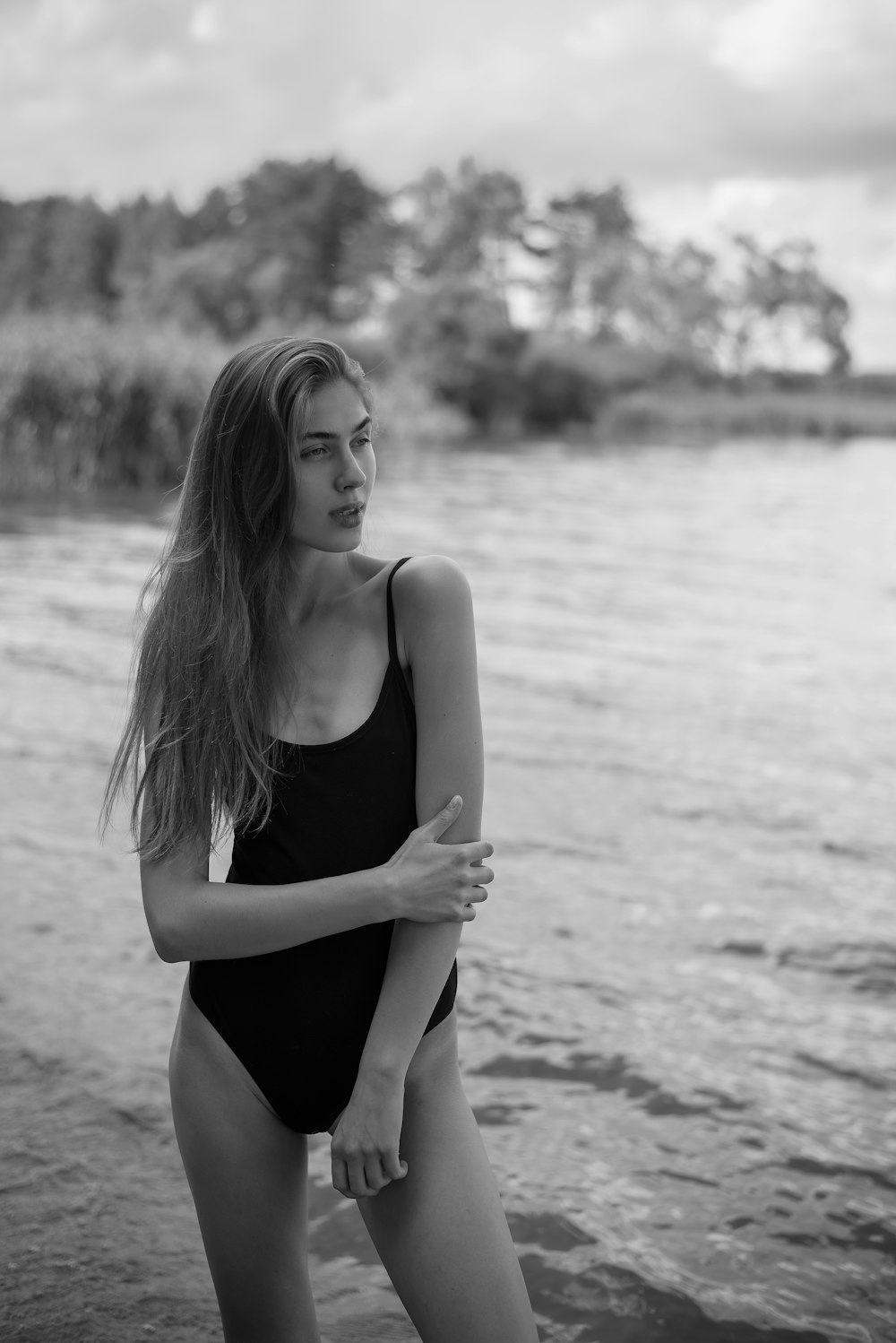 a woman in a swimsuit on a beach