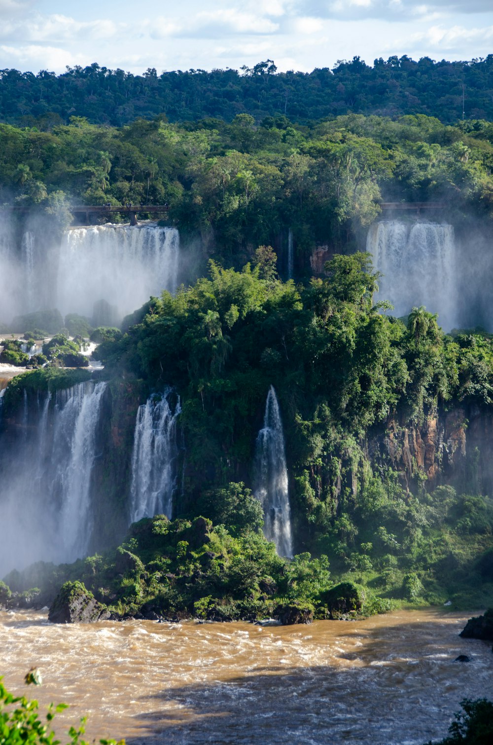 a group of waterfalls and trees