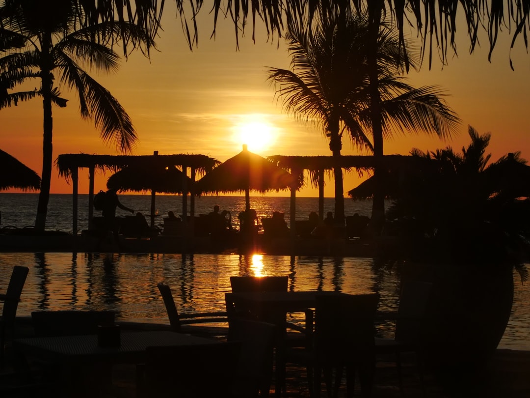 a sunset over a beach,