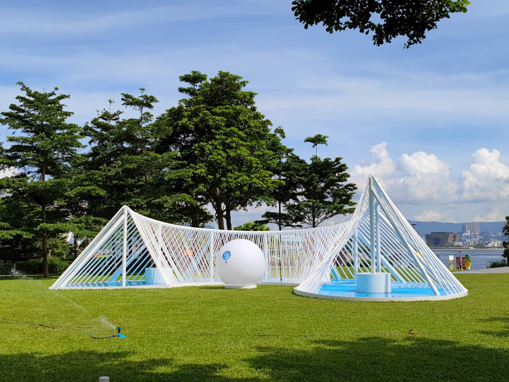 a large white tent in a grassy field