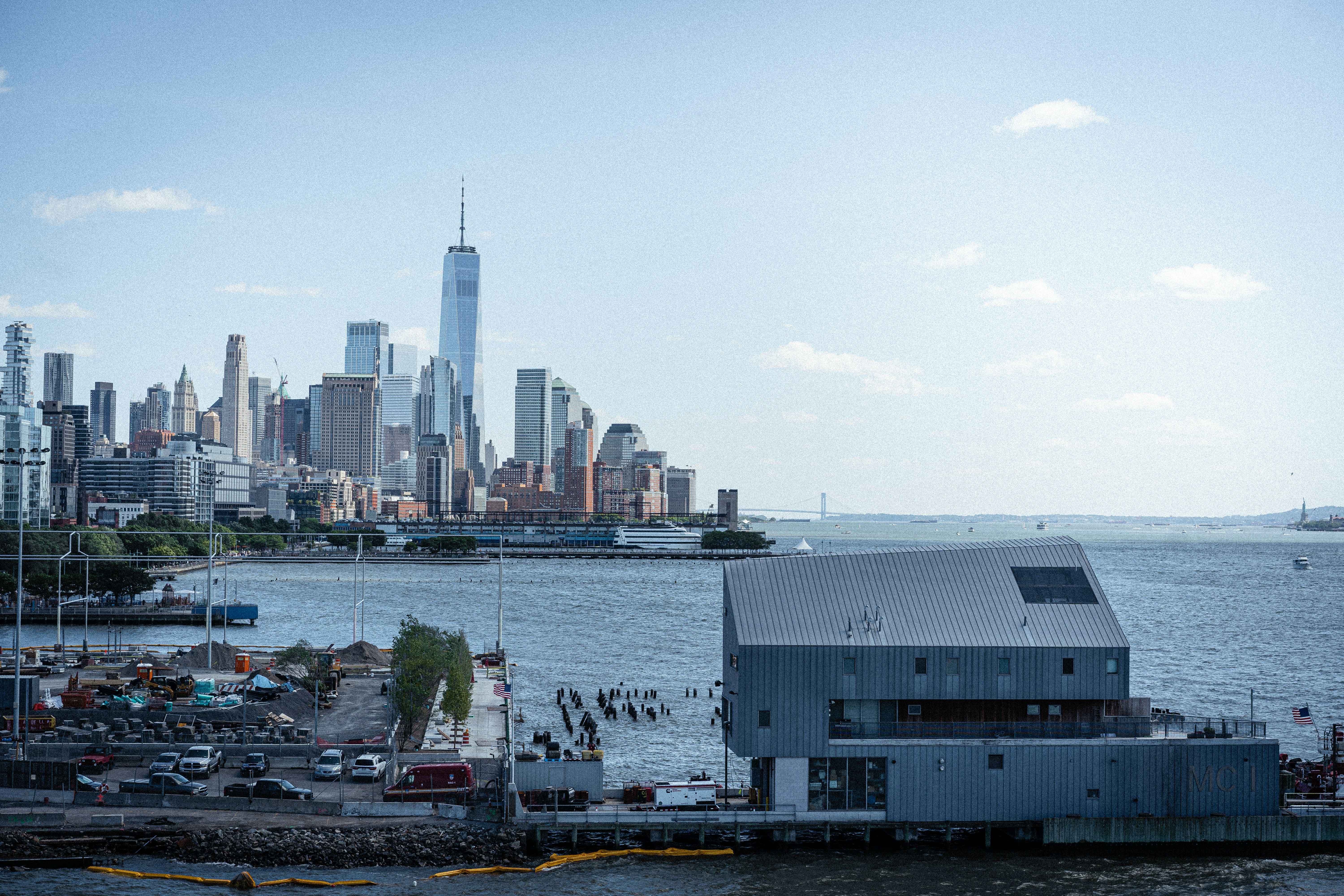 a large body of water with a city in the background