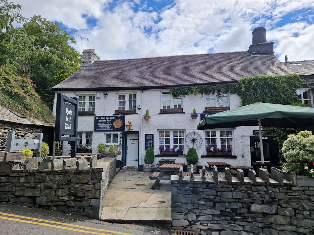 a building with a stone wall and a stone wall