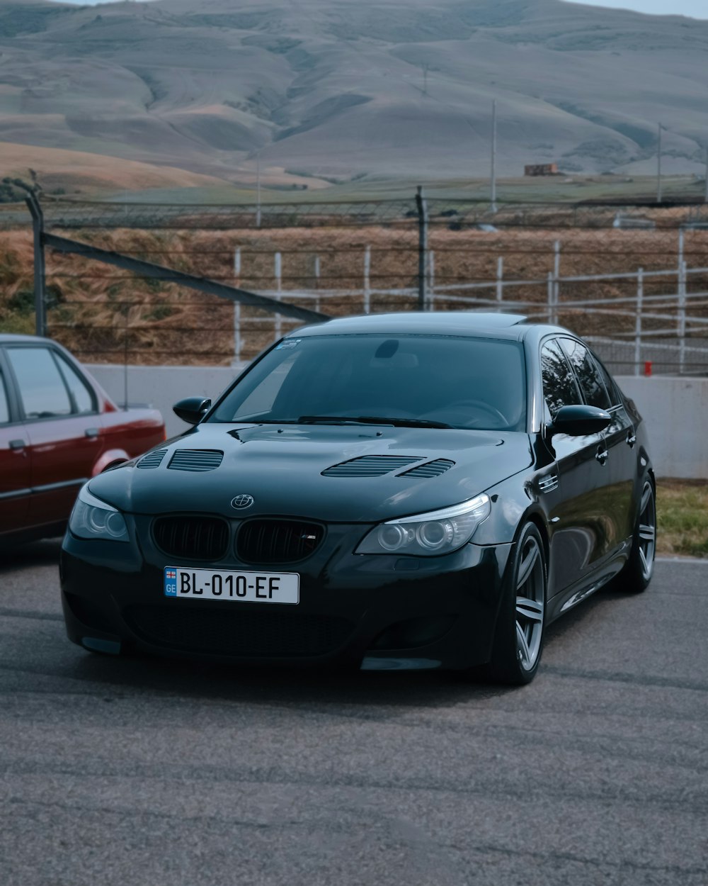 a black car parked on a road