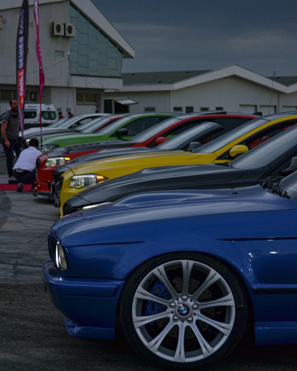 a row of cars parked in a parking lot