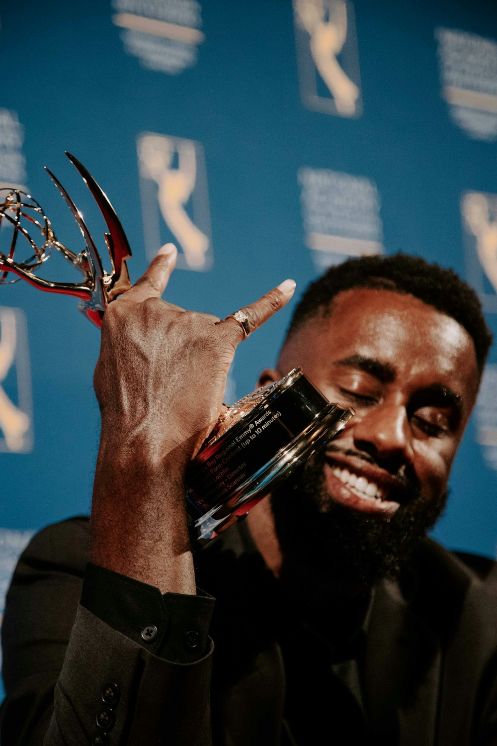 a man holding a key chain