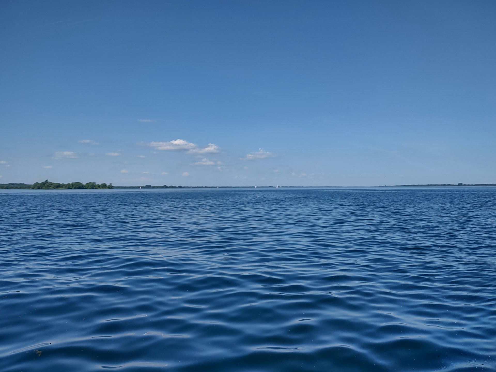 a body of water with land in the distance