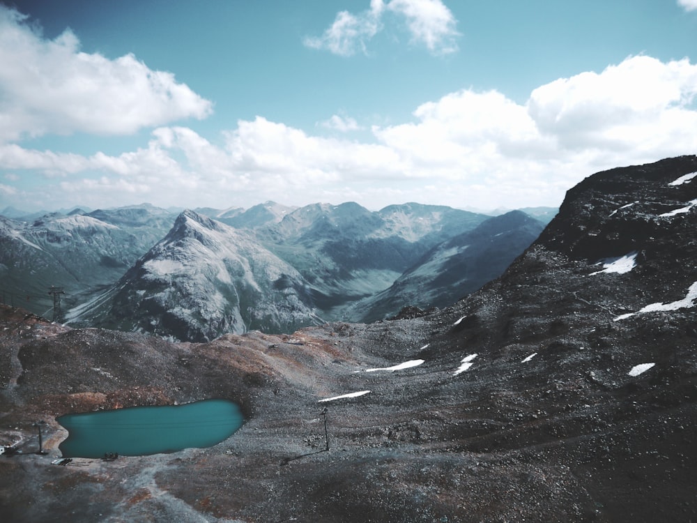 a lake in a snowy mountainous region