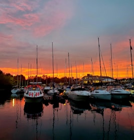A panoramic view of yachts docked at a marina in Macedonia during sunset.