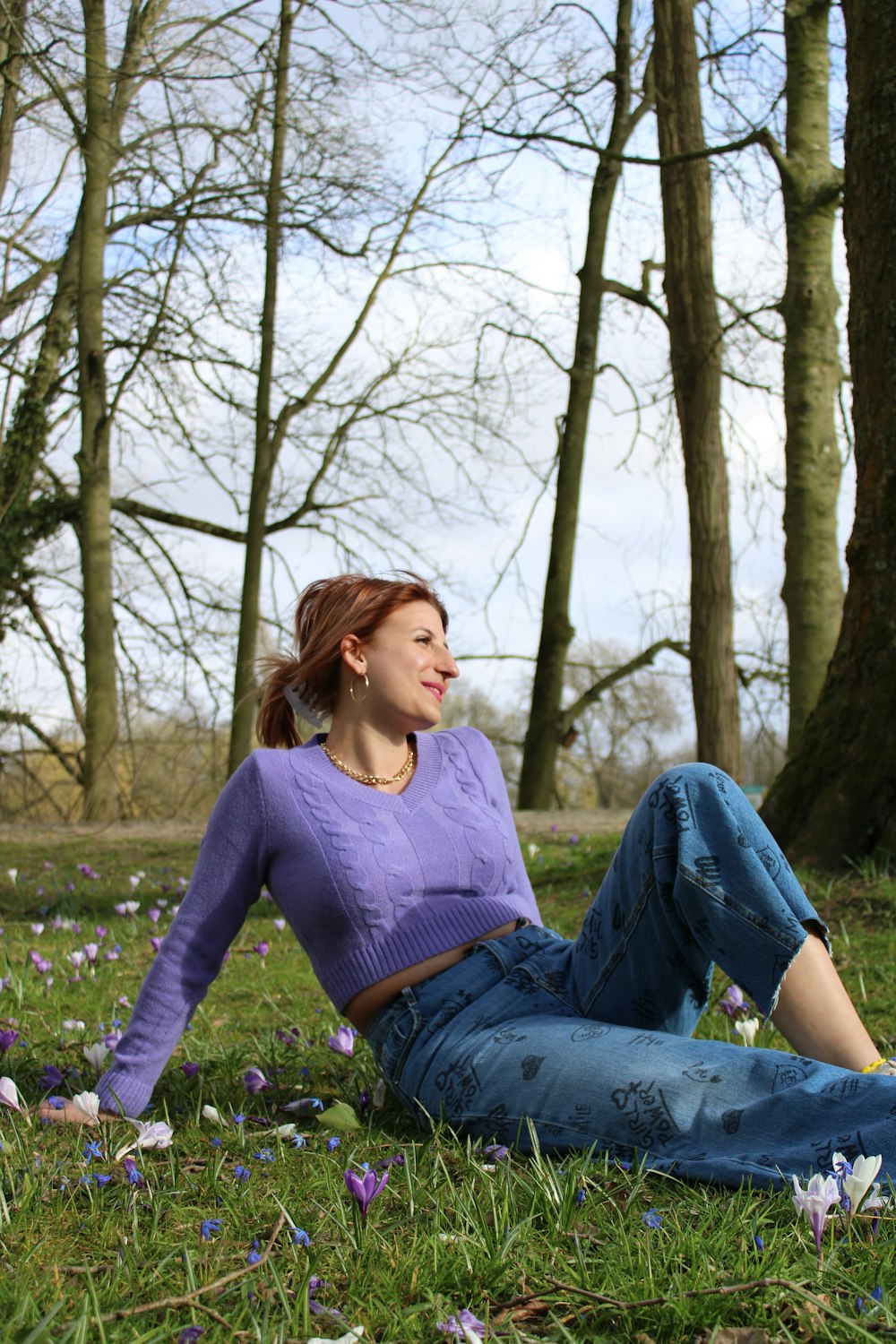 a person sitting in a grassy area