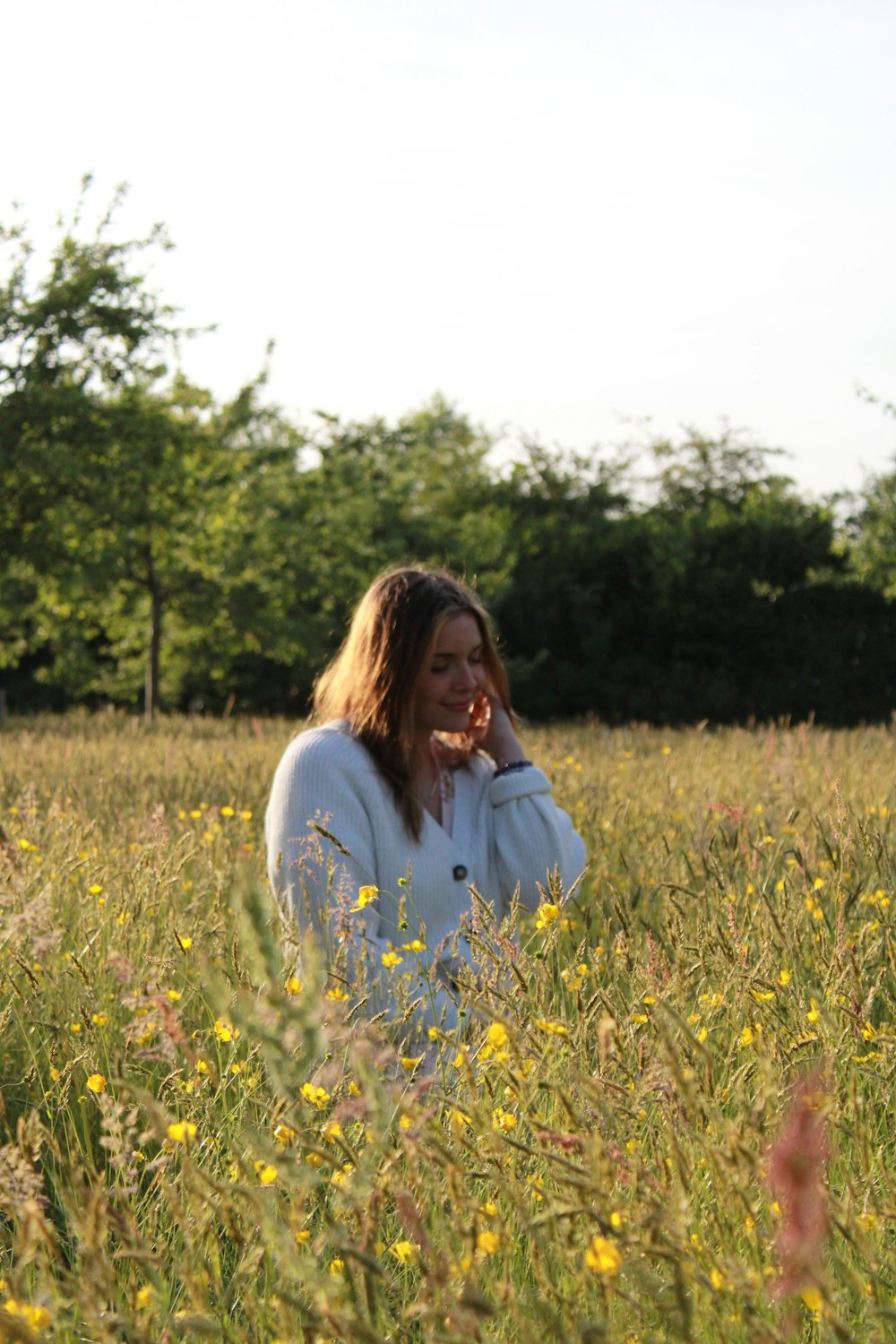 a person standing in a field of flowers