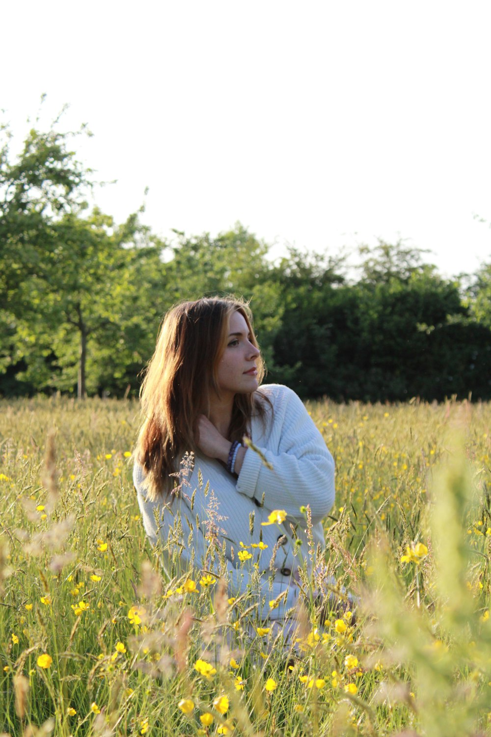 a person standing in a field of flowers