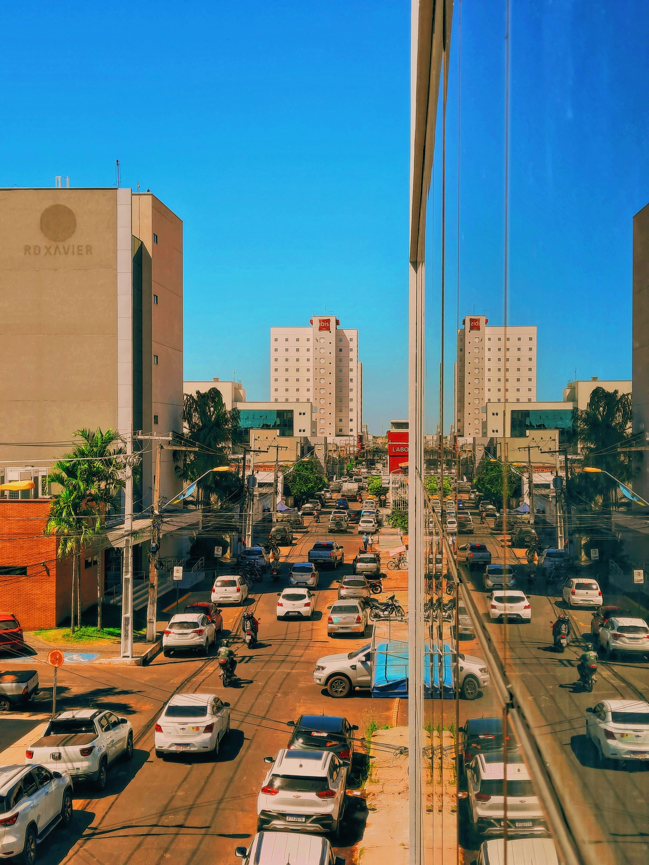 a busy street with cars and people