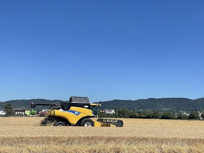 a yellow tractor in a field