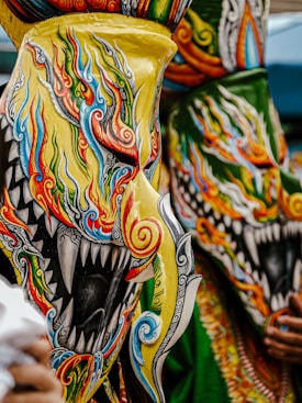 a colorful mask with a black face