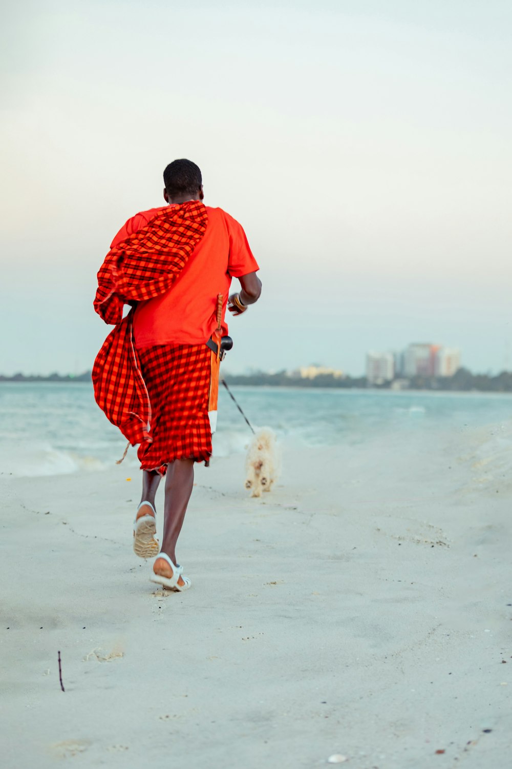 a man walking on a beach