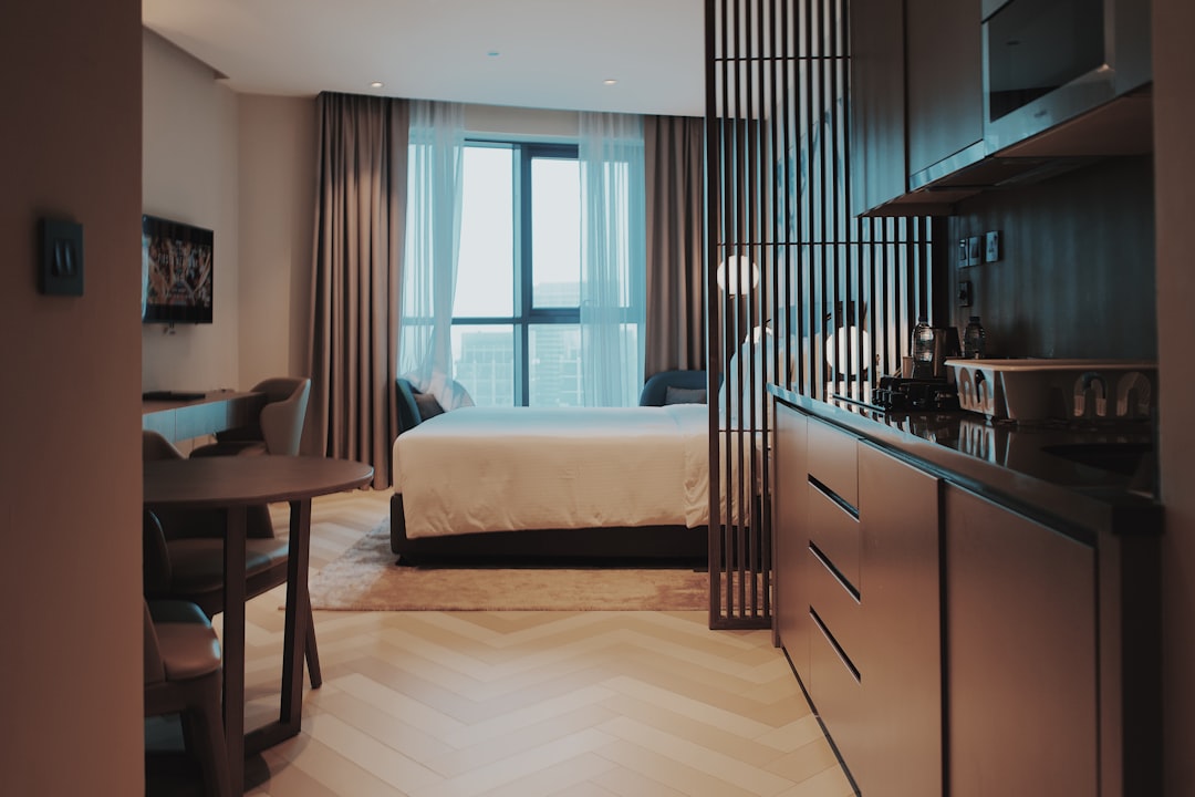 a bedroom with a bed and a table,