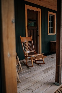 a chair sitting in front of a wooden door