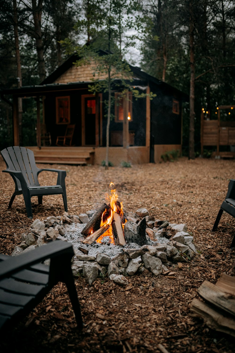 a wooden bench sitting in front of a picnic table