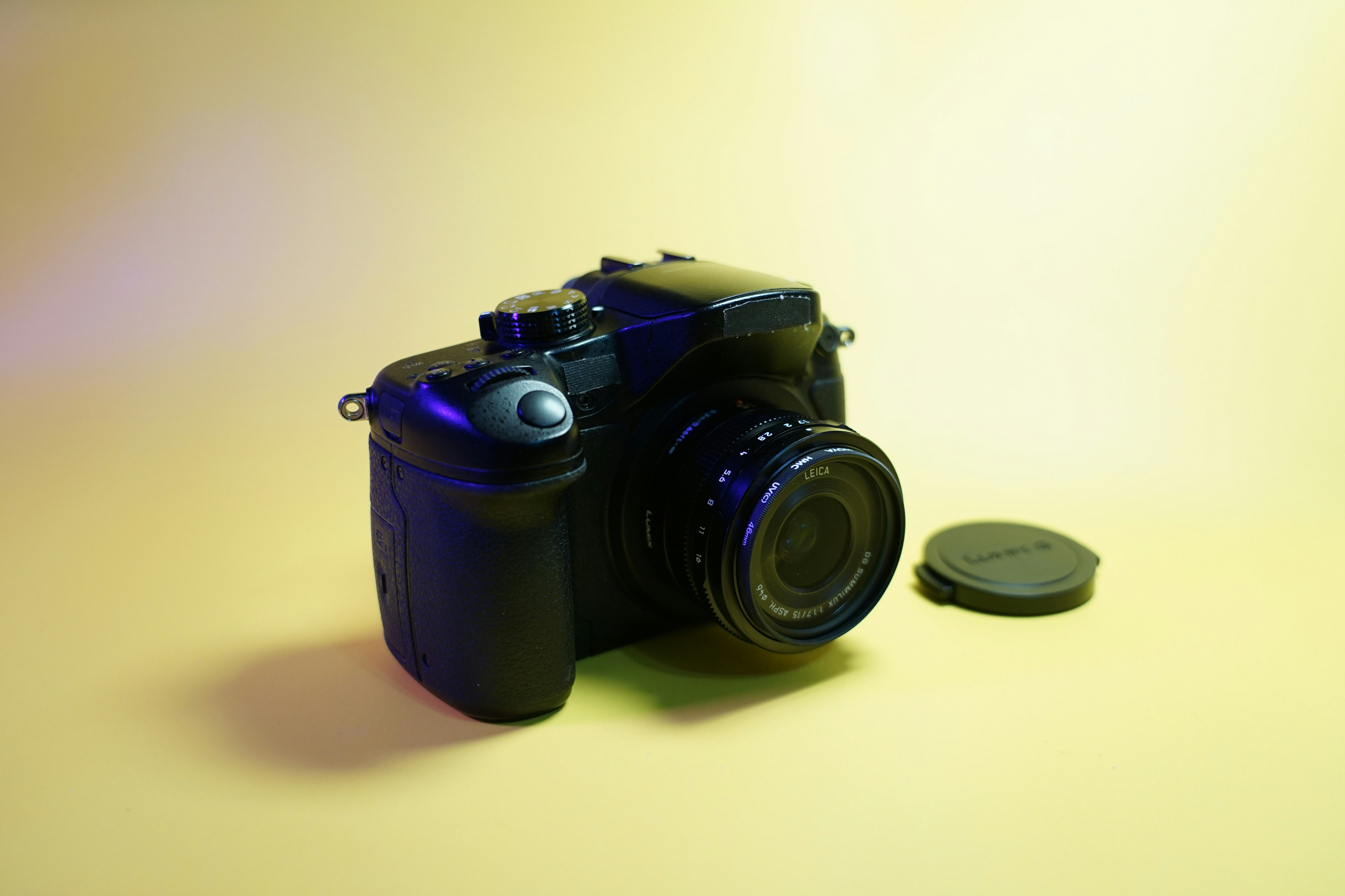 Classic Leica camera on grey surface in well-lit studio