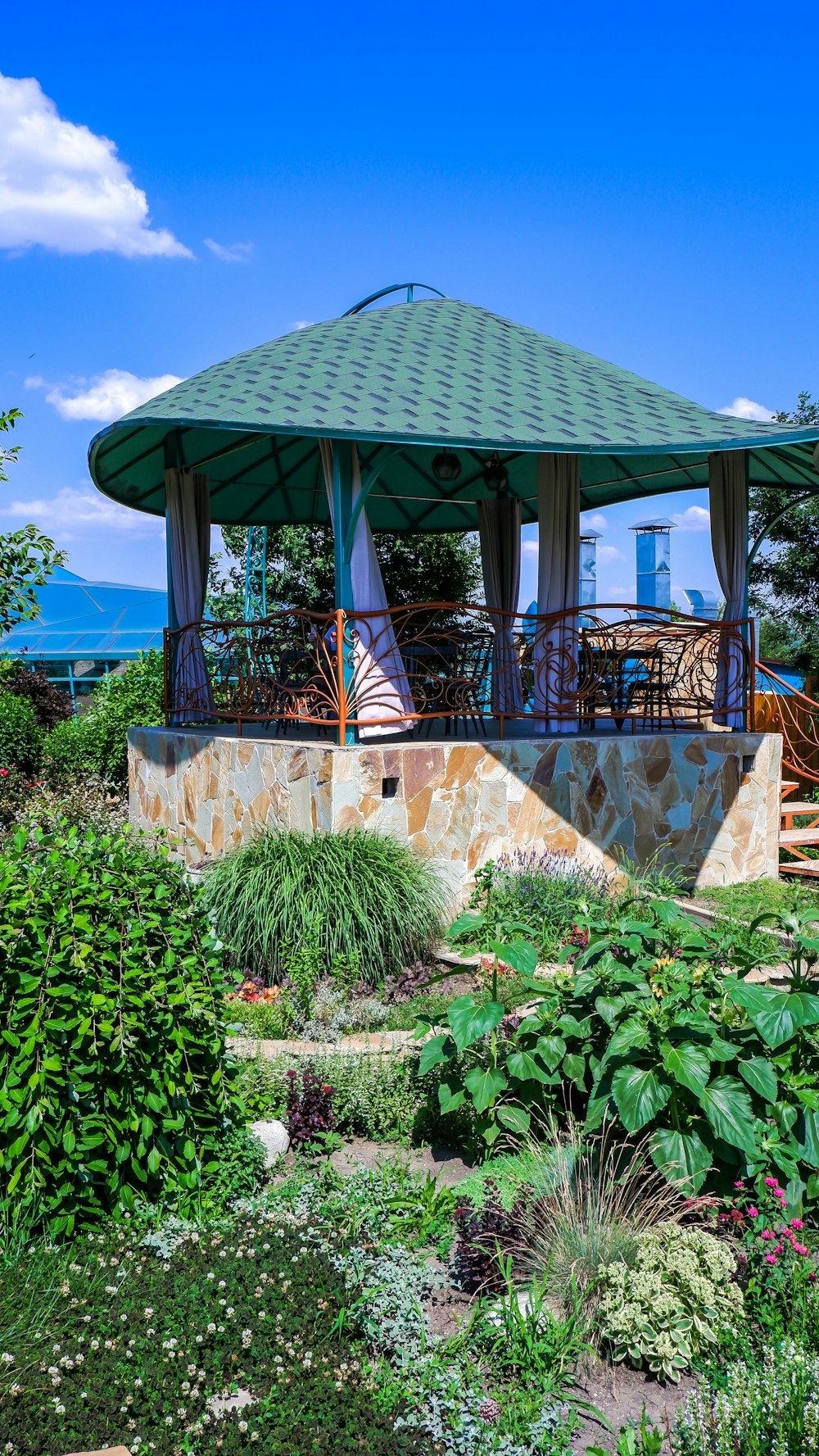 a gazebo with a green roof