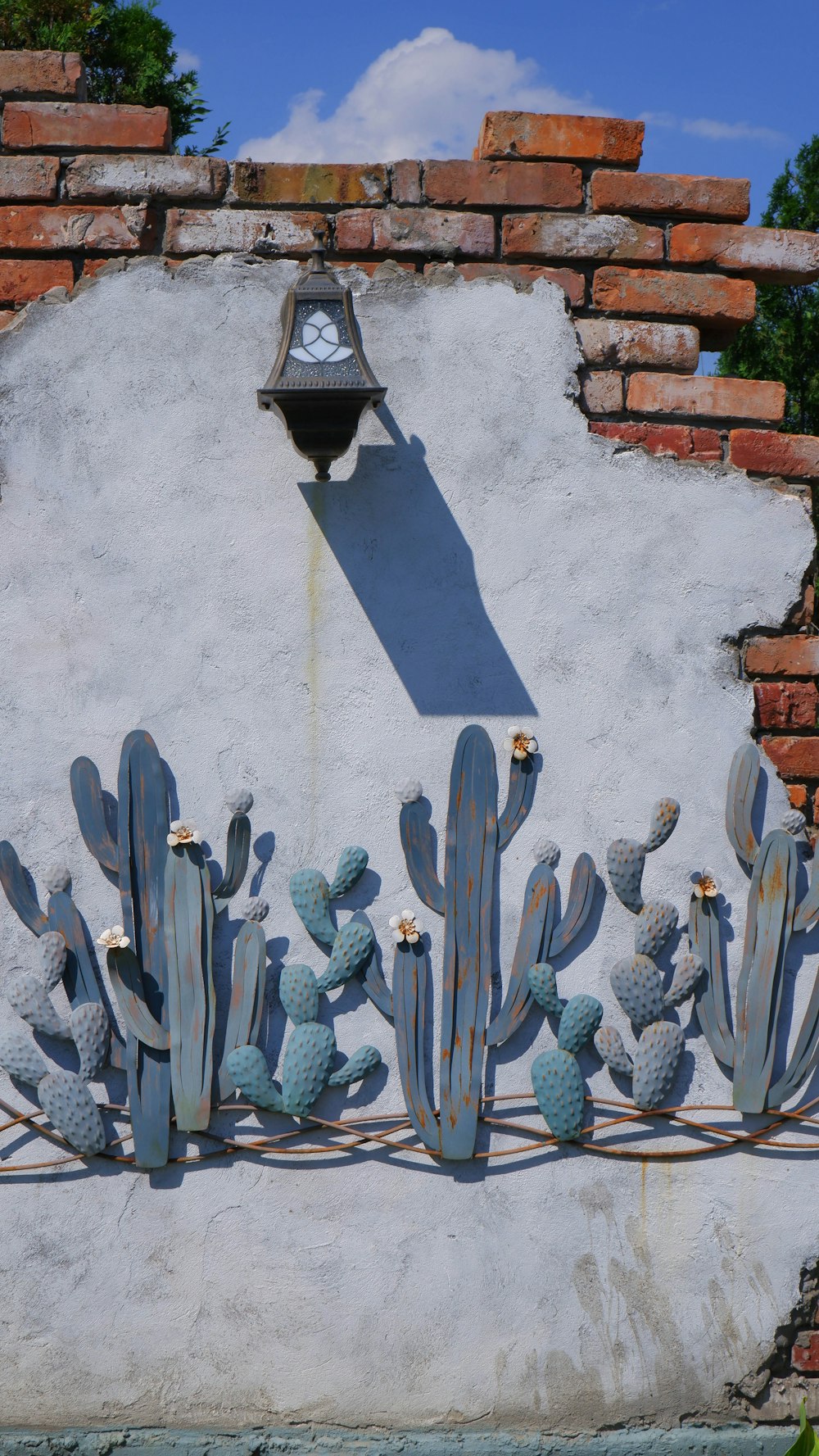 a stone wall with a statue on it