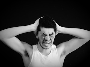 a person with the hand on the head