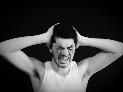 a person with the hand on the head