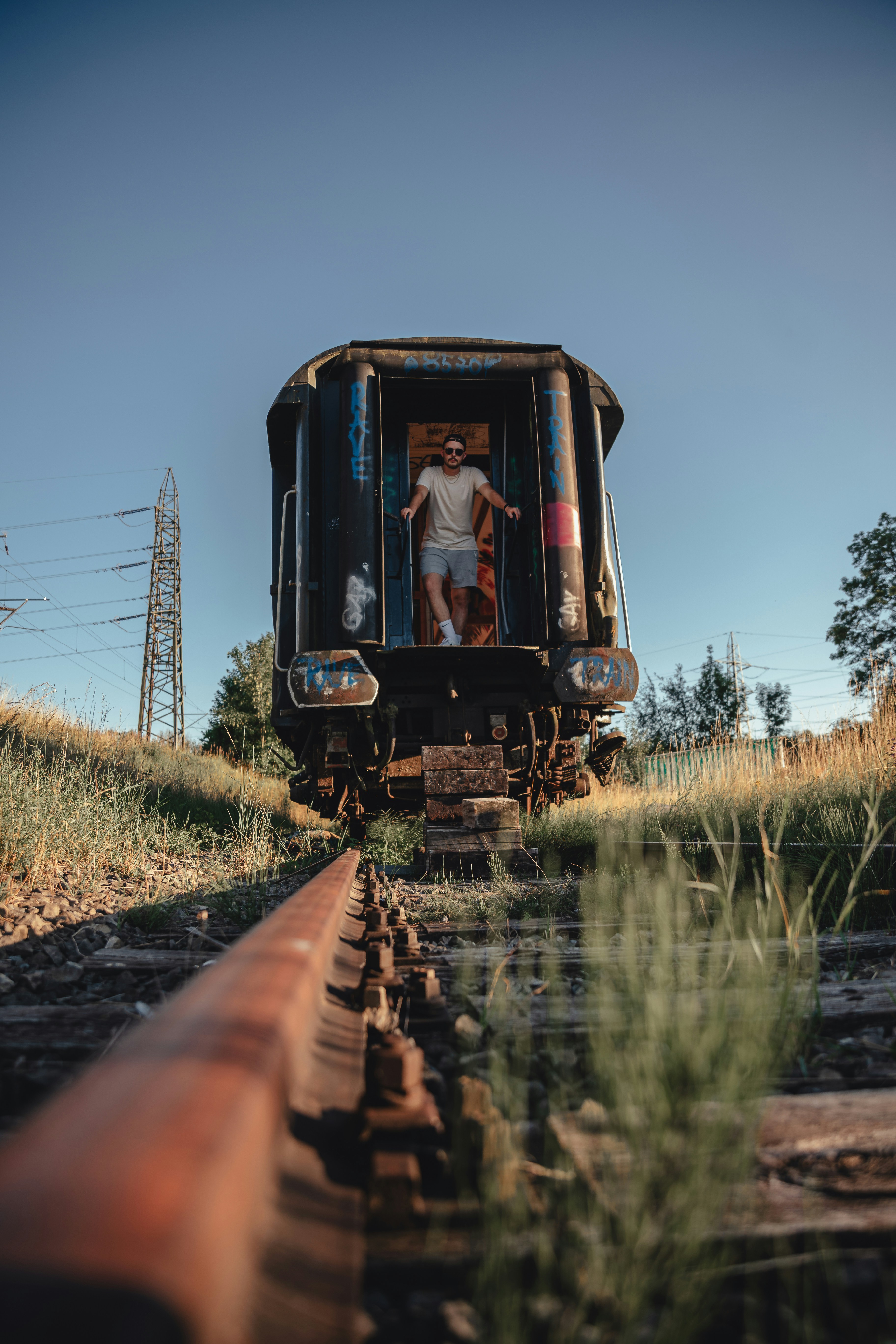 a person standing on the back of a train