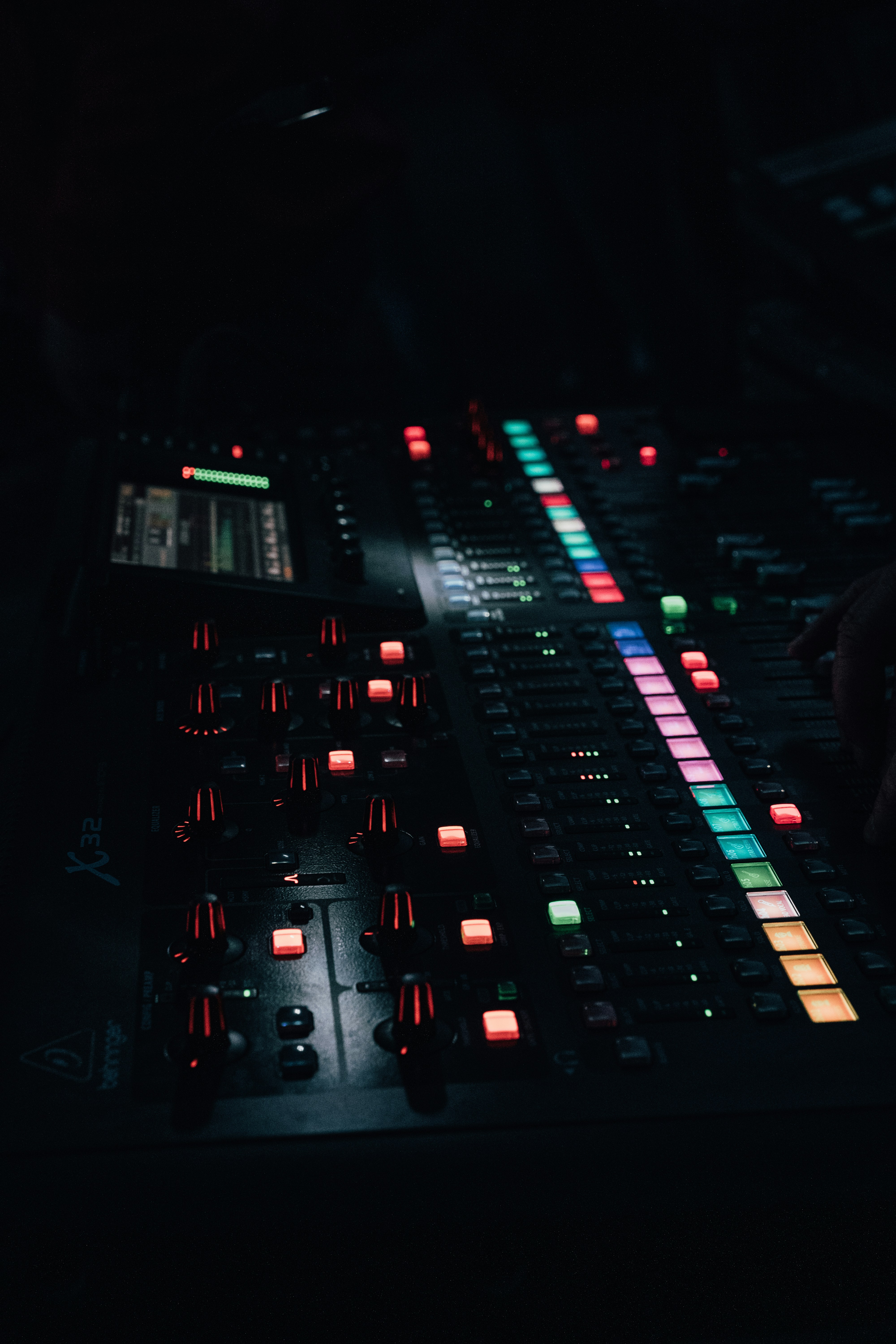 a car driving on a road with many lights