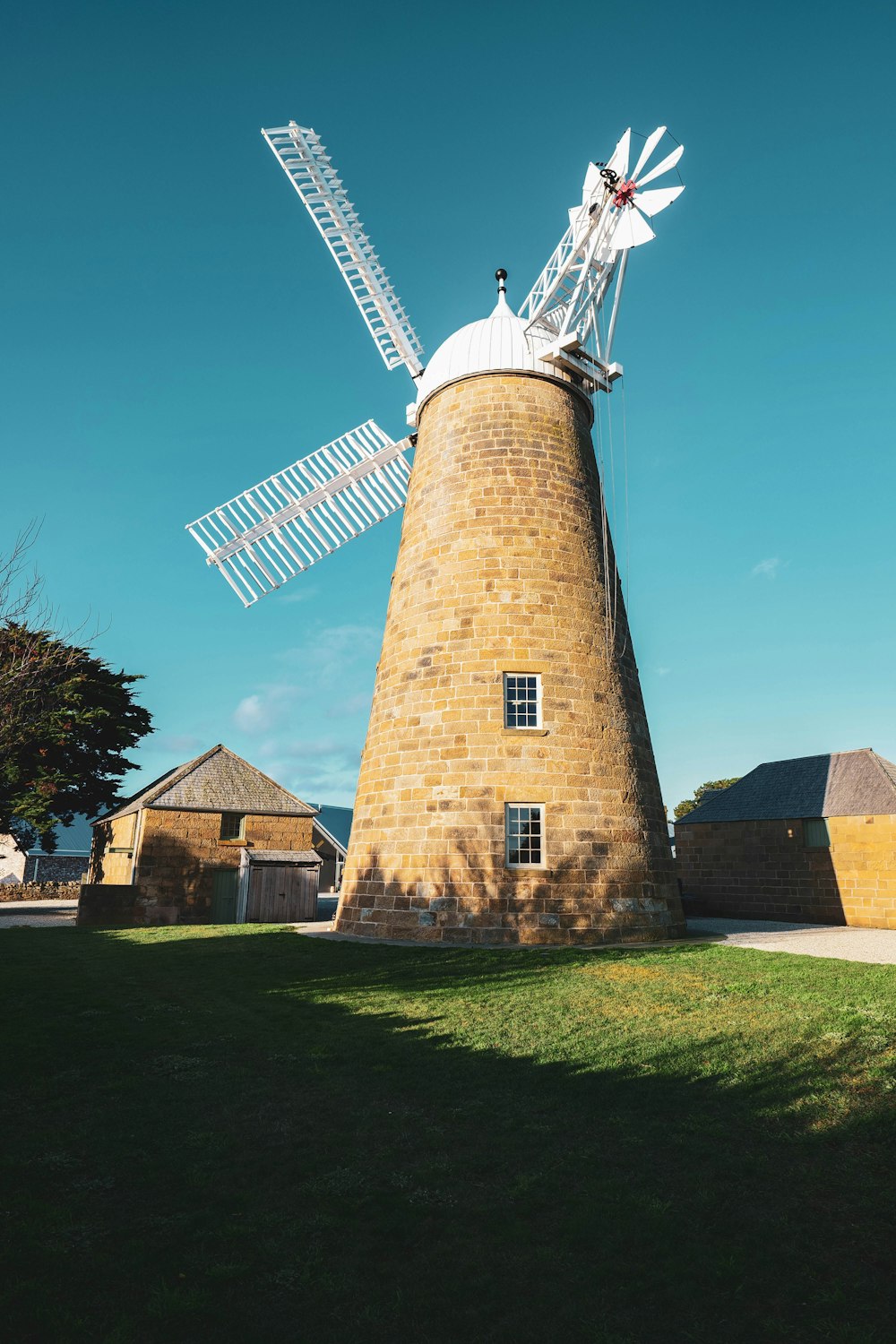 a windmill on a brick tower