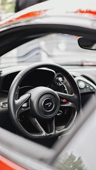 a steering wheel and dashboard of a car