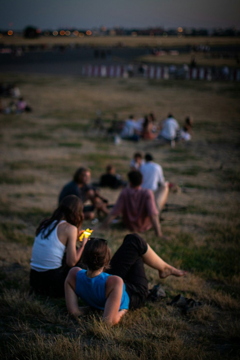 a group of people sitting on the ground