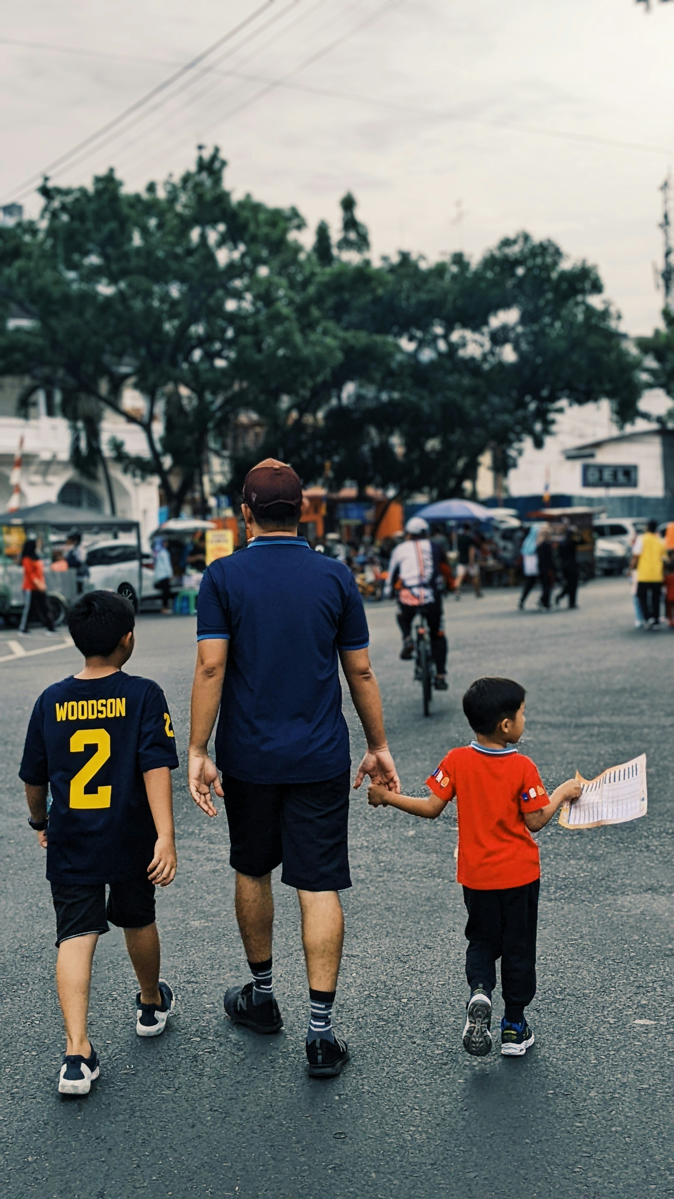 a person walking with a group of kids