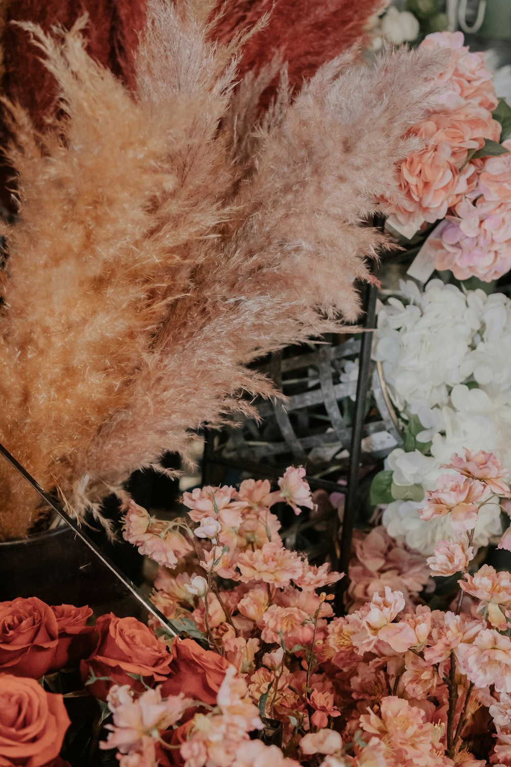 a person with a lion head surrounded by flowers