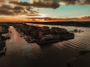A peaceful view of Fairfield Harbour's waterfront homes at sunset.