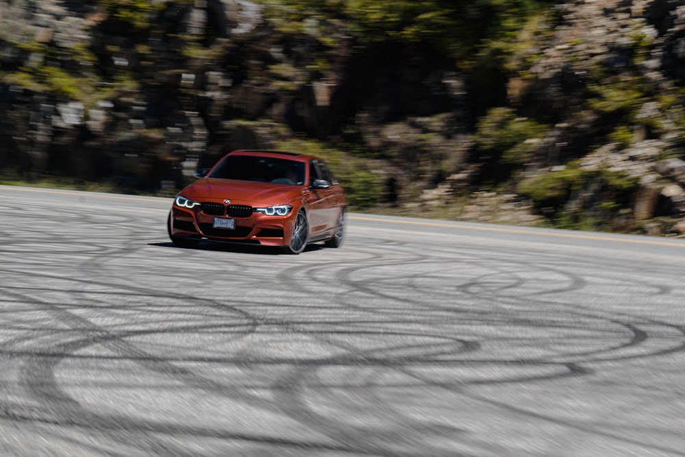 a red race car on a road