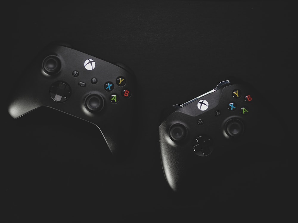a pair of black video game controllers
