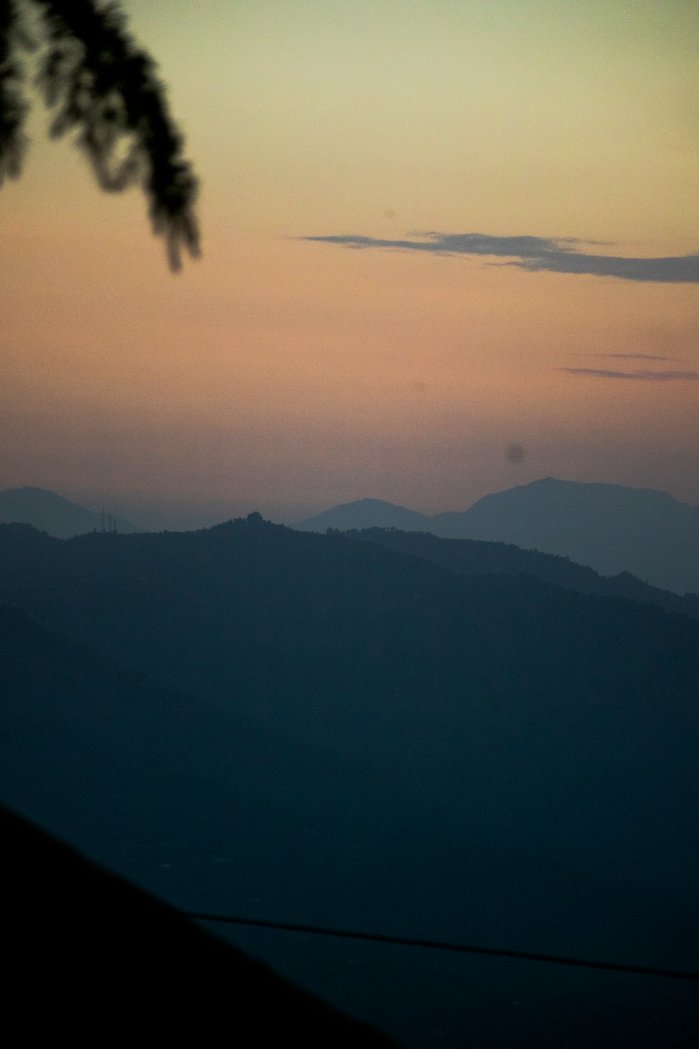 a view of mountains and clouds