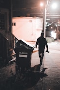 a man walking down a sidewalk