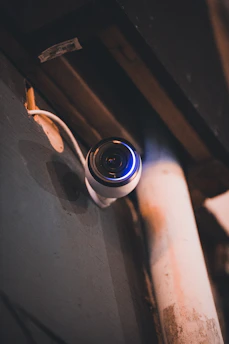 a hand holding a black and blue object