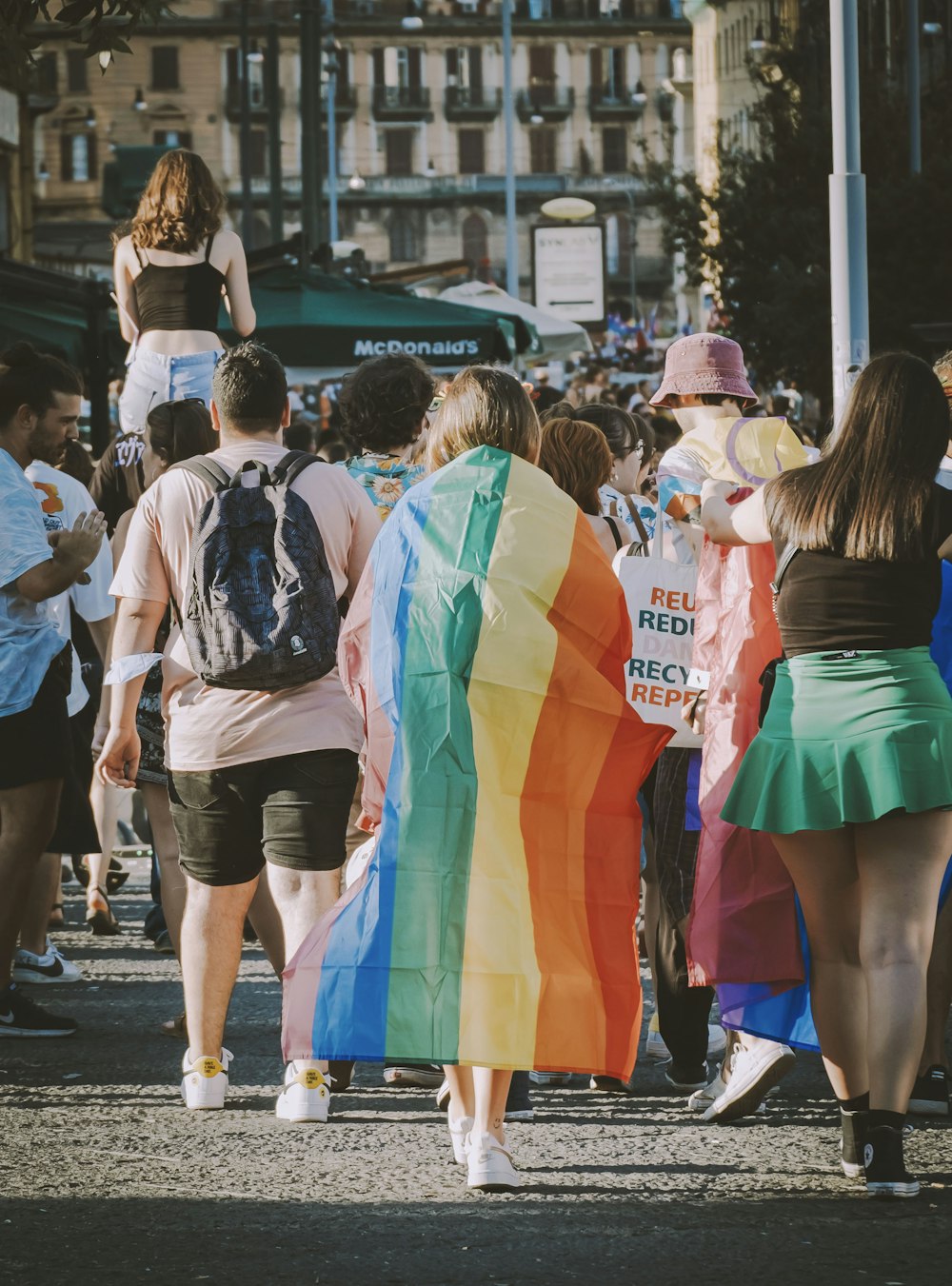 a group of people walking down a street