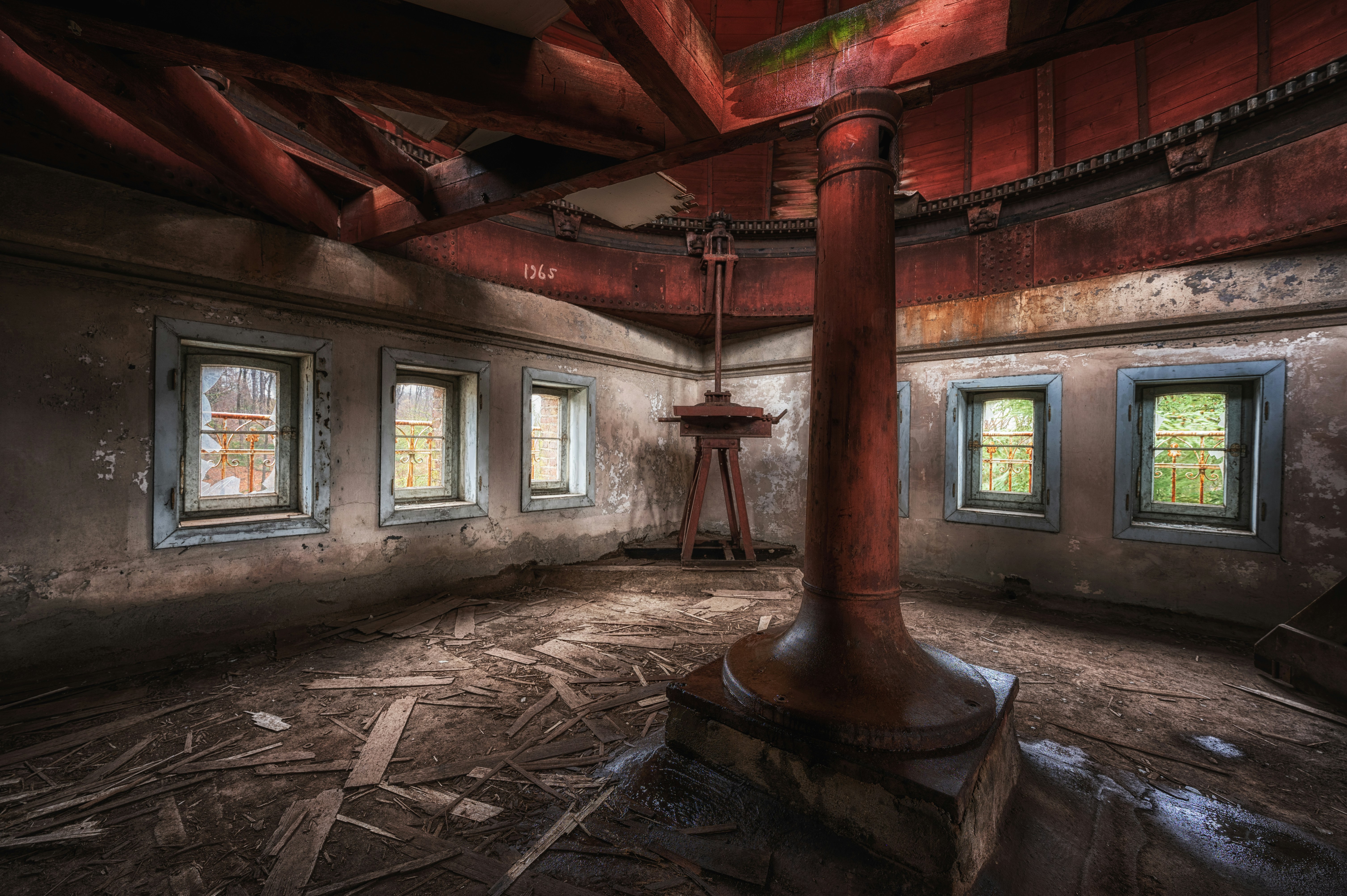 a room with a fireplace and windows